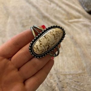 Faux white Buffalo cuff.